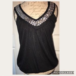 Fun, sparkly top with rhinestone neckline!